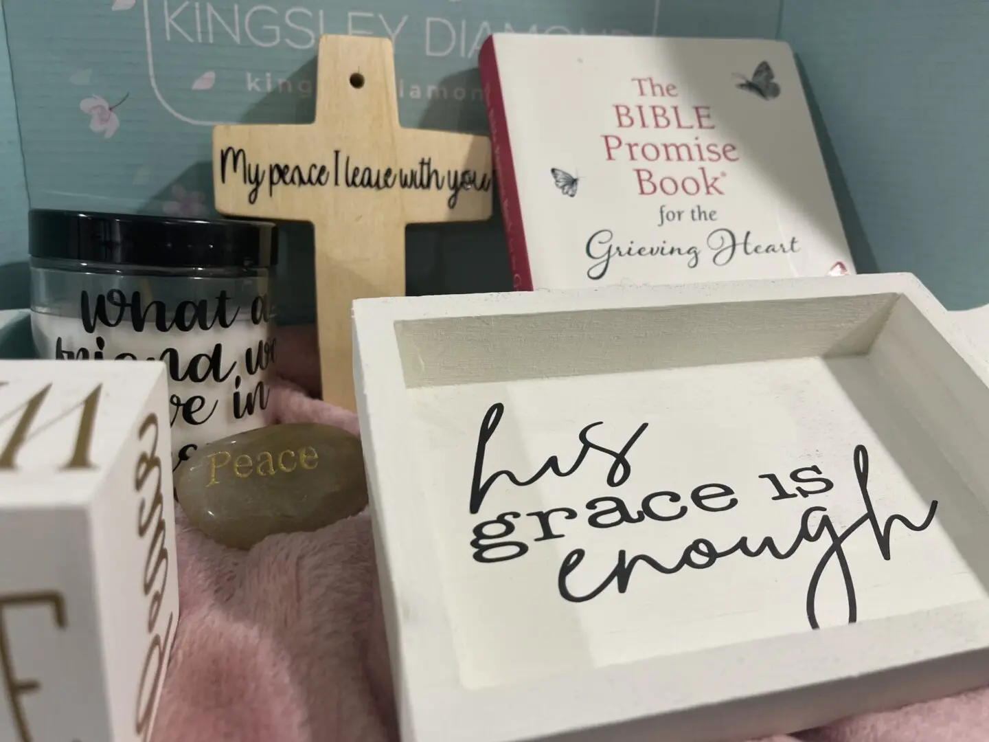 Grace is enough written inside a box along with other products